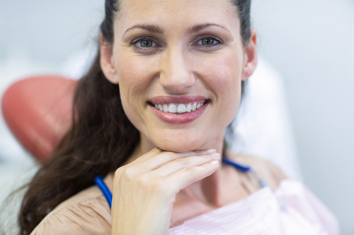 smiling woman sitting in dental chair