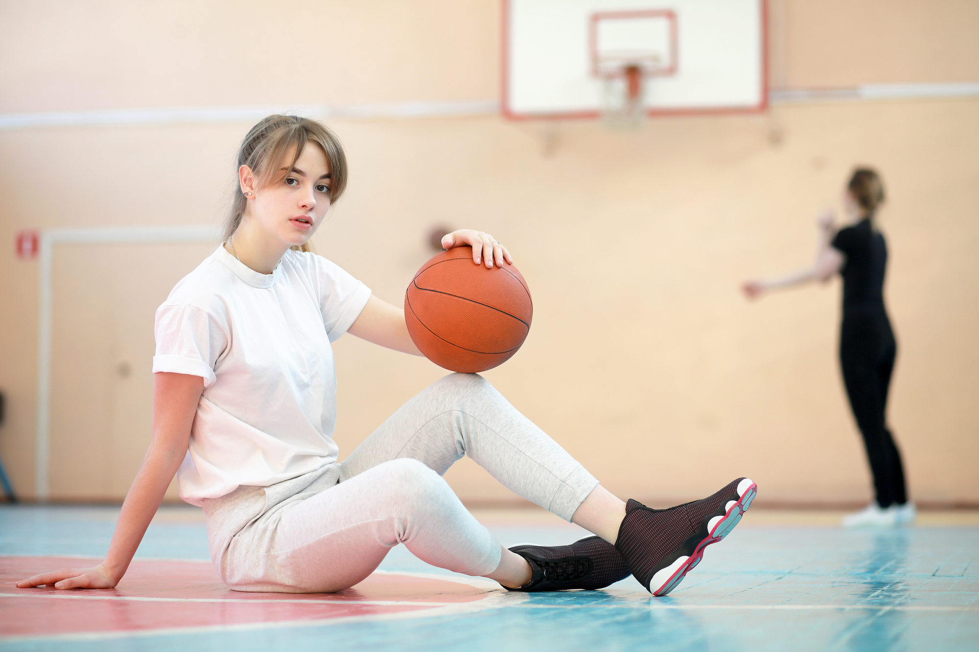 Teen basketball player with a healthy smile.