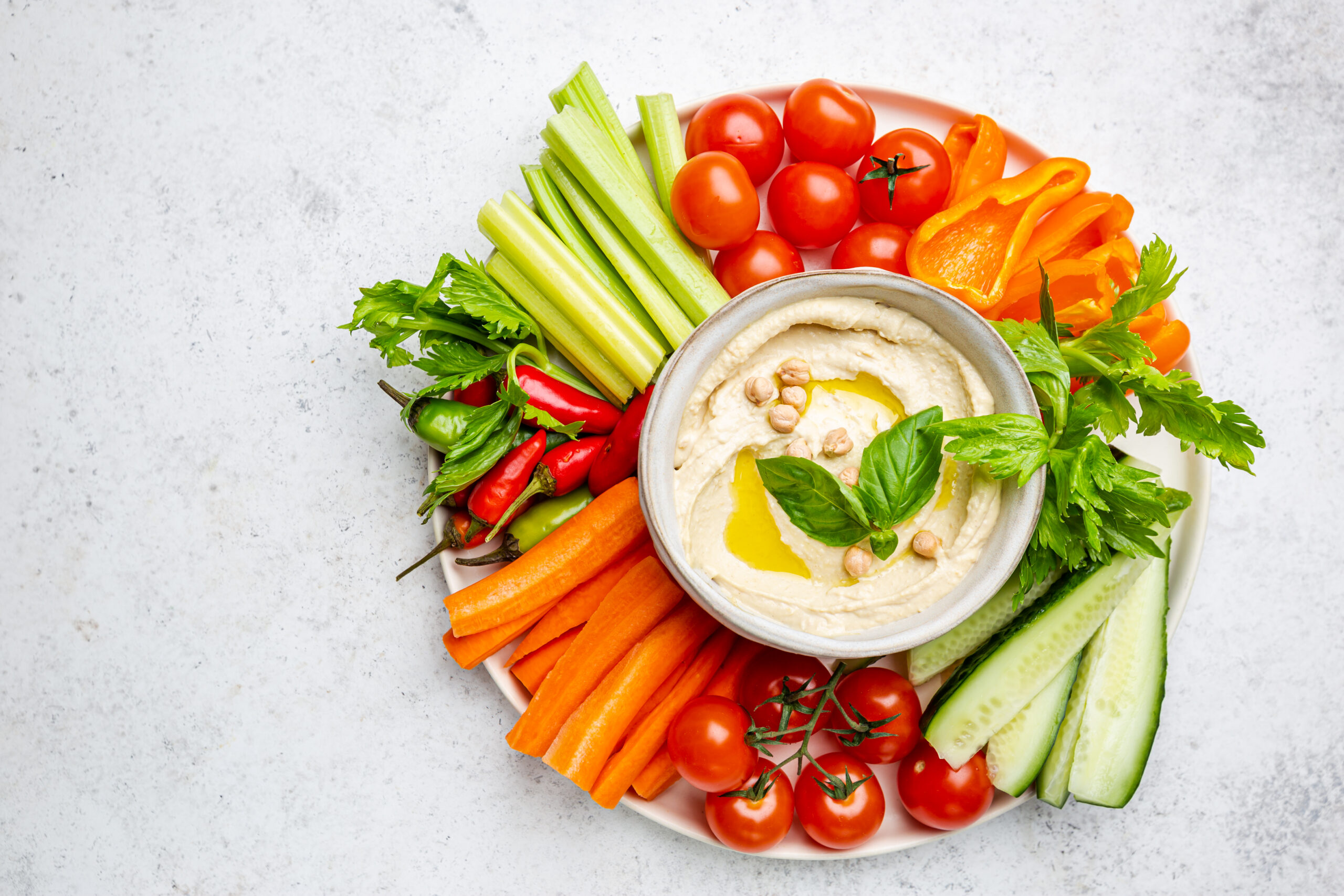 Colorful vegetables with hummus for healthy teeth. 