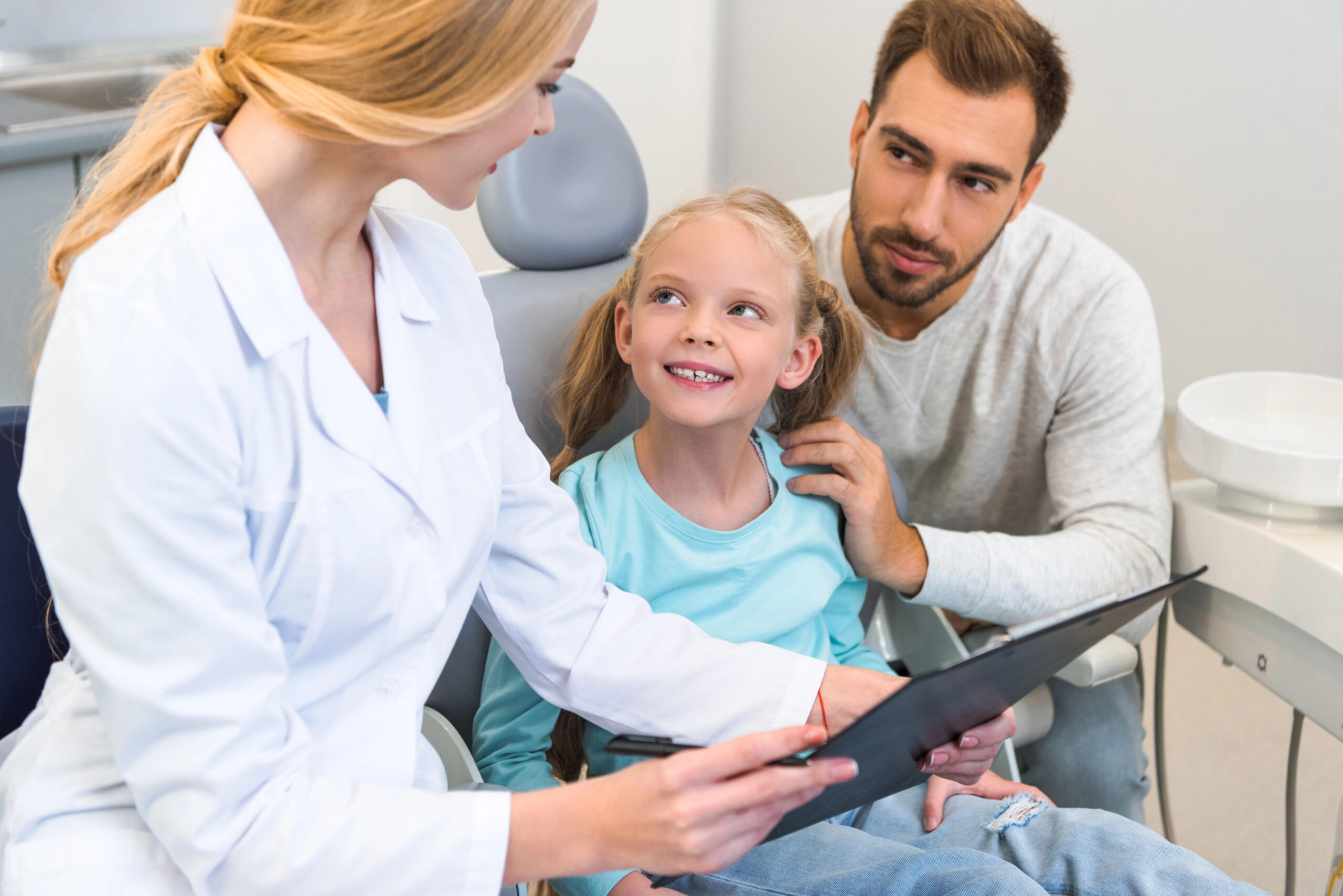 Parent and child at the pediatric dentist's office. 