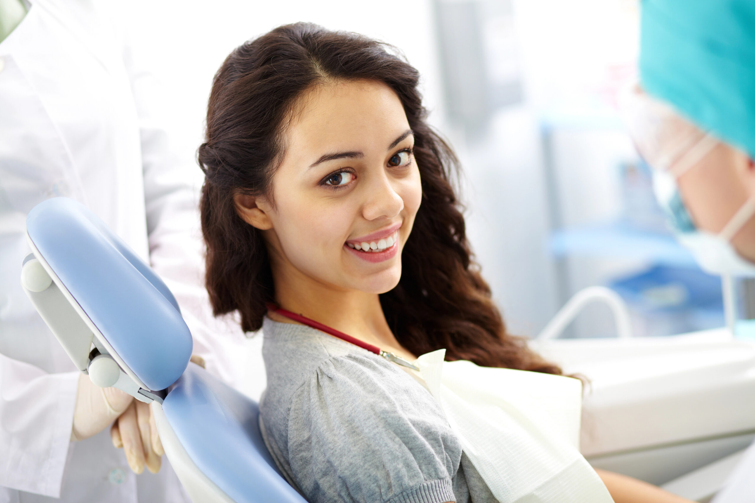 Young woman with healthy smile at dentist