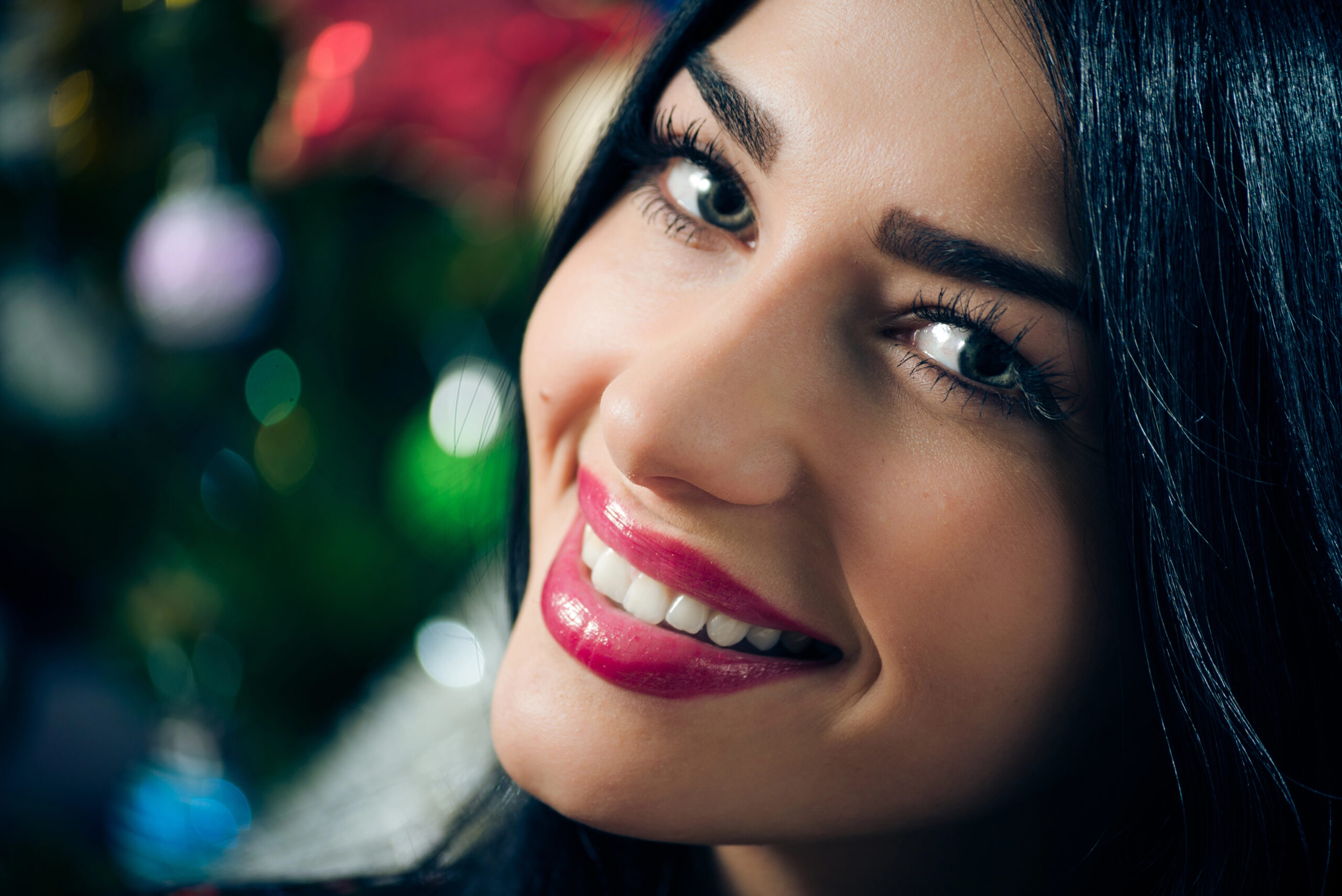 Woman with white smile and holiday decor