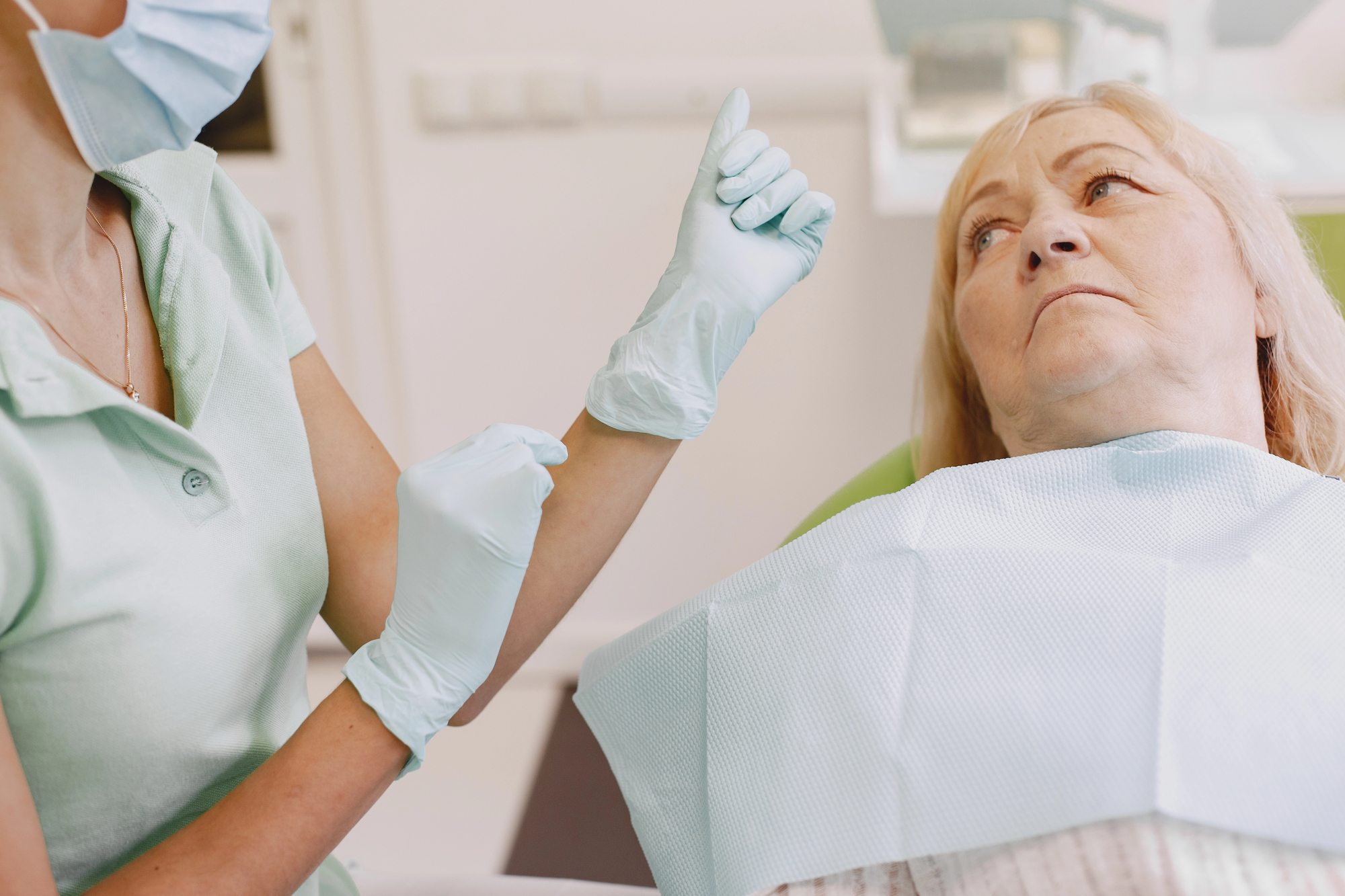 Senior woman at dentist office. 