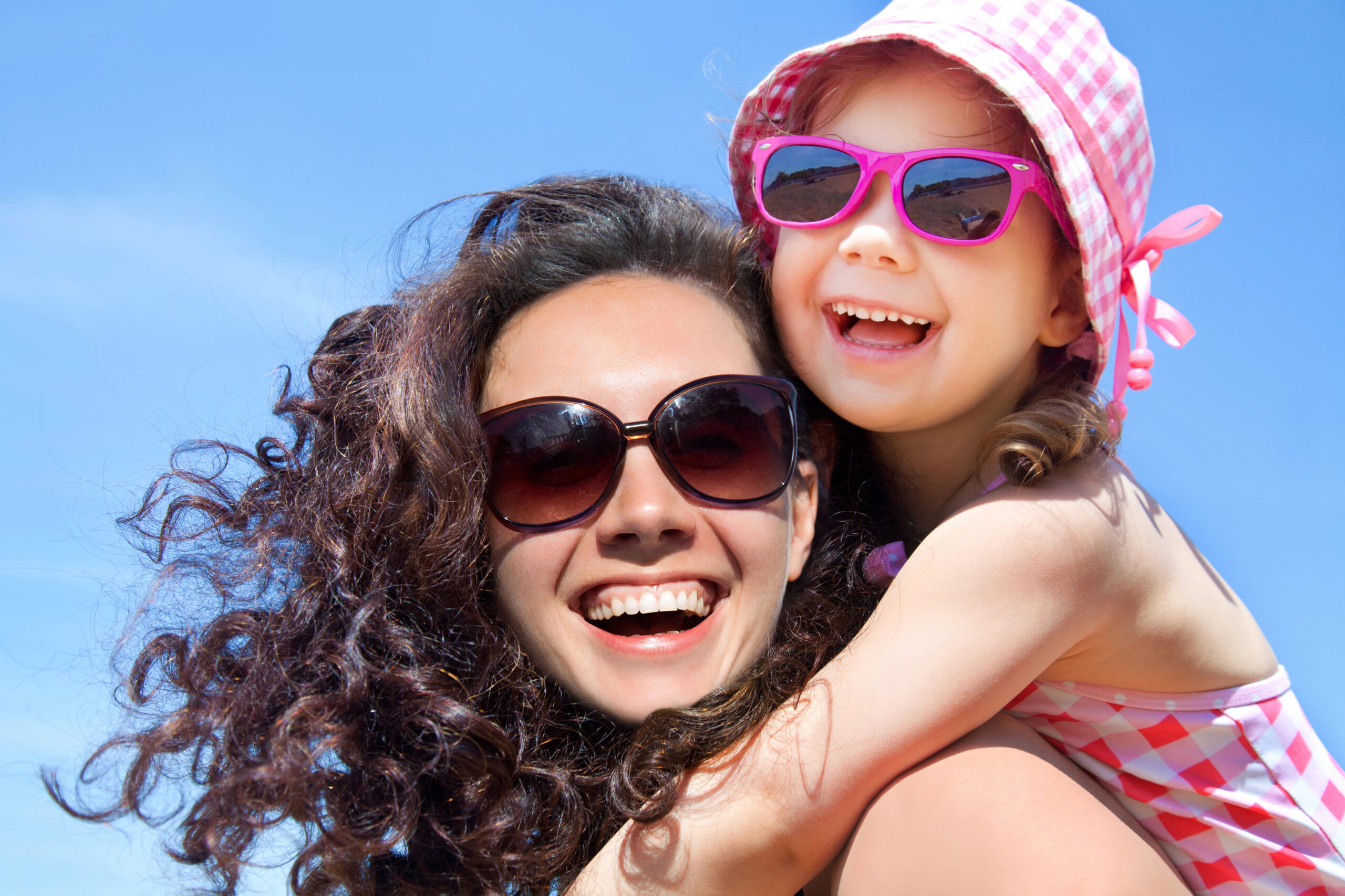 Mother and child with healthy smiles in summer.